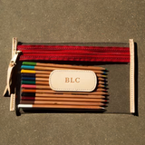 Clear slim pouch for organizing pens, tickets, phone, or small essentials.