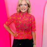 Sheer mesh striped top with leopard print and short sleeves.