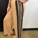 Sweatpants with leopard print side stripes, lace trim and elastic waistband.