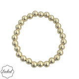 7mm gold filled beaded bracelet with stretch fit and waterproof design.