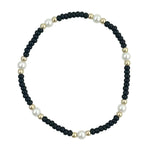 Black waterproof bracelet with gold-filled beads and glass pearl accents.