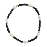 Black waterproof bracelet with gold-filled beads and glass pearl accents.