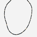 Gold filled necklace with black and grey beads and gold accents.