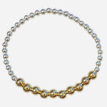 Mixed metal bracelet with sterling silver and gold-filled waterproof beads.