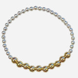 Mixed metal bracelet with sterling silver and gold-filled waterproof beads.