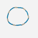 Gold filled bracelet with turquoise beads, pearl accents, and stretch fit.