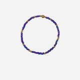 Gold filled bracelet with purple Czech glass beads and stretch fit design.