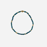 Gold filled bracelet with teal Czech glass beads and stretch fit design.