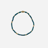 Gold filled bracelet with teal Czech glass beads and stretch fit design.