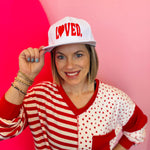 White LOVED embroidered baseball cap with heart detail and adjustable snapback closure