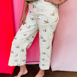 Beige cuffed pants with allover mallard duck print and relaxed fit