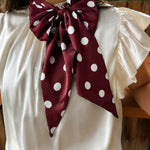 Maroon and white silky polka dot scarf with versatile styling options.