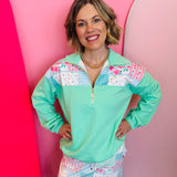 Heirloom patchwork print quarter zip pullover with colorblock design and gold hardware detail