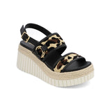 Mia Yuris Leopard Sandals with raffia-inspired texture, wedge heel, slingback strap, and gold buckle detail.