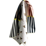 Crae Milk and Honey reversible microfiber hand towel, 19x29 in, striped front and cream bee print back.