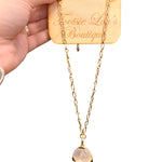 Gold chain necklace with mother of pearl pendant and elongated oval links. Water-proof design.