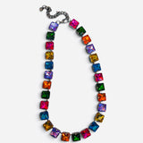 Multicolor necklace with oversized faceted crystals in pink, orange, yellow, green, blue, and purple.