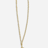 Gold-tone pendant necklace with faceted green, pink, yellow, and smoky crystals.