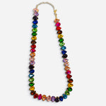 Gold-tone necklace with multicolor faceted teardrop crystals in vibrant jewel tones.