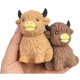 Neutral Highland cow squishy stress toy with soft sensory texture.