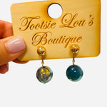 Water-resistant ocean blue marbled drop earrings with gold posts and 1.25-inch elegant drop.