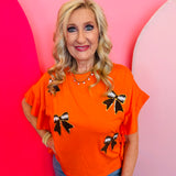 Orange ruffled side top with round neck and football chenille patches 