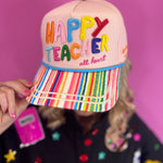 Neutral teacher hat with colorful Happy Teacher embroidery, striped bill, and classroom details.