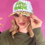Blue striped hat with green So Very Thankful embroidery, leopard bill, and gold piping.