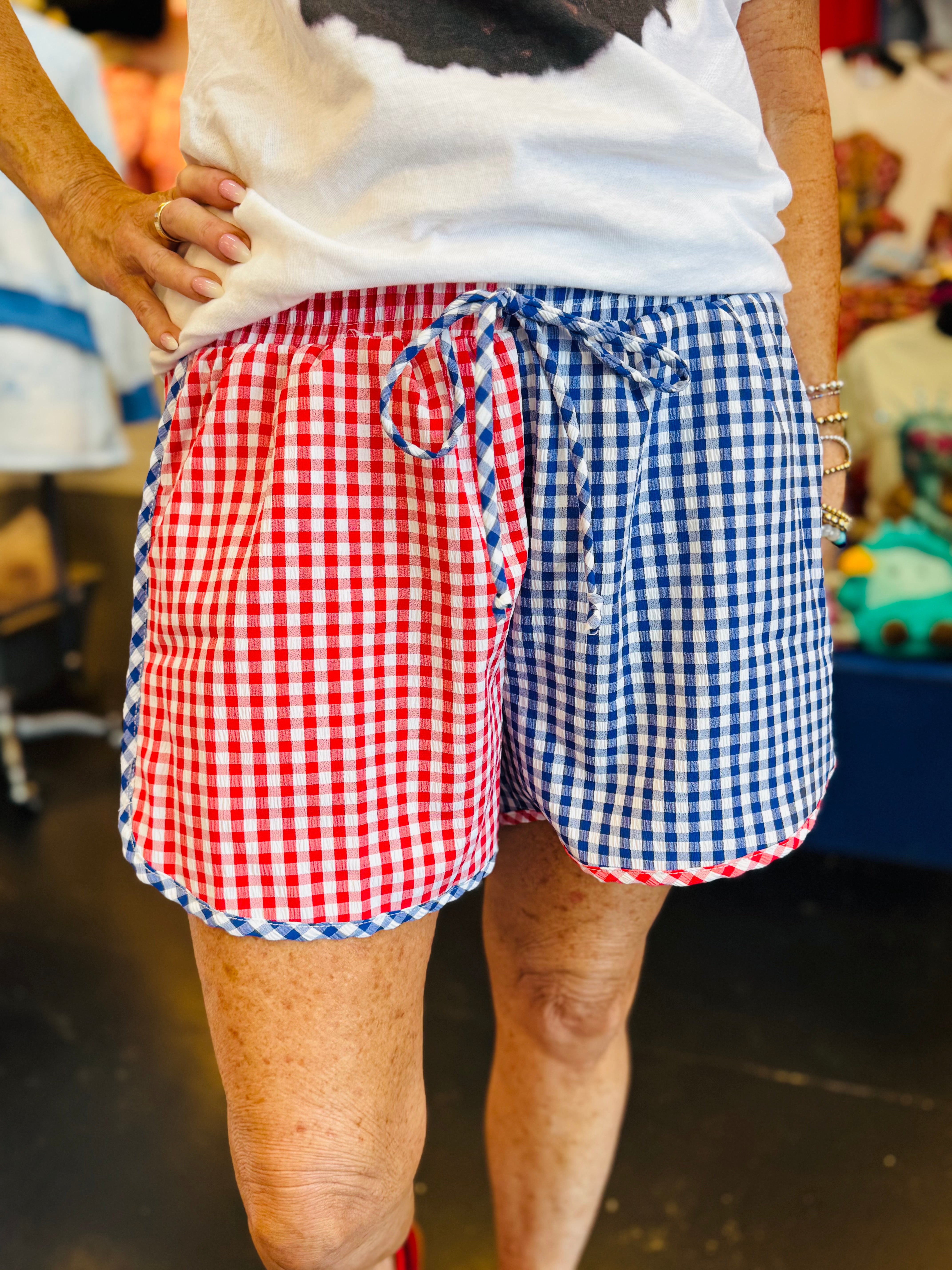 Red and blue gingham color block shorts with elastic waistband