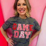 Red Game Day tee with patchwork appliqué lettering and mixed print details.