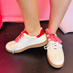 Cream sneakers with red panels and retro gingham lace detail