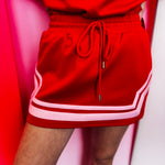Red mini skort with drawstring waist and contrast trim