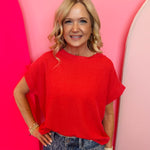 Red raised ribbed cap sleeve top with boat neckline and relaxed silhouette