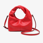 Red vegan leather clutch with twisted handles and removable crossbody strap