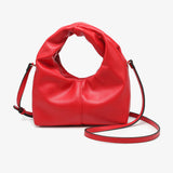 Red vegan leather clutch with twisted handles and removable crossbody strap