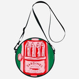 Sardine round crossbody bag with adjustable strap and zip closure.