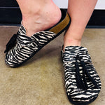 Shu Shop Ariana zebra print hair-on mule with black fringe and adjustable buckle.