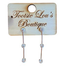 Silver crystal bar drop earrings with three round-cut crystals and vertical bars.