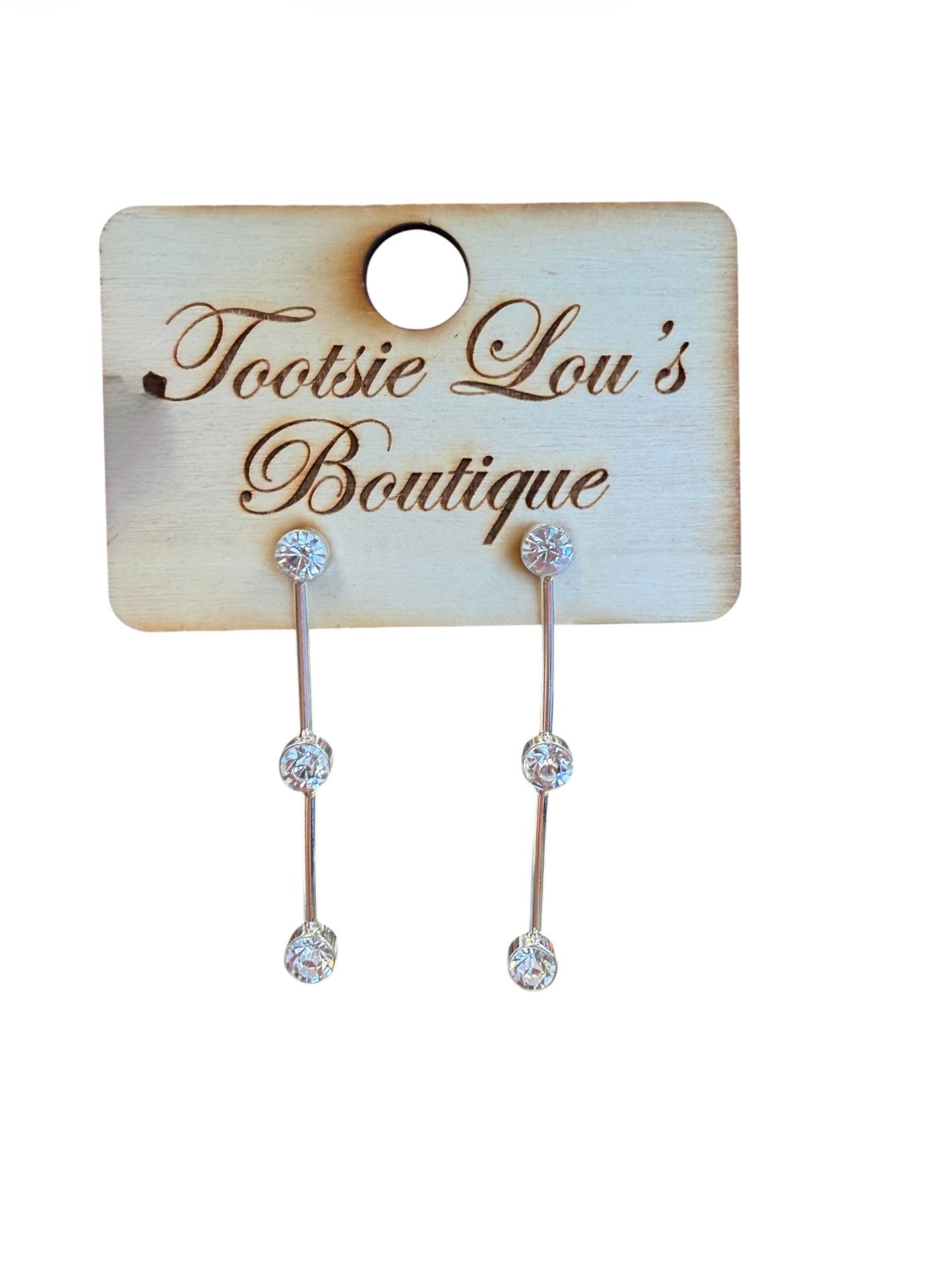 Silver crystal bar drop earrings with three round-cut crystals and vertical bars.