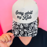 Two-tone snapback hat with Sorry About My Kids embroidery and black white paisley bill