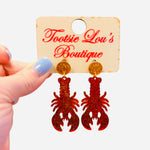 Red glitter lobster earrings with gold glitter stud tops.