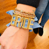 Stretchy charm bands bracelet with elastic design, stackable style, and customizable charm letter option