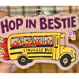 Struggle Bus freshie with flaming bus graphic and Hop In Bestie wording.