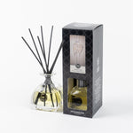 Sweet Grace reed diffuser with glass bottle and fragrance reeds.