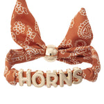 Texas Longhorns bandana slider bracelet with gold HORNS charms and adjustable fabric band.