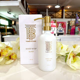 Thomas Blonde Blonde hand soap in white glass bottle with gold pump.