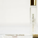Thomas Blonde Joshua Tree roll-on perfume with clear quartz crystals in 10 mL bottle.