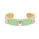 Antique gold cuff with green enamel and sparkling crystal accents.