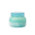 Capri Blue Volcano Luce d'Amalfi candle in turquoise textured sea glass vessel.