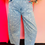 Light wash barrel jeans with white polka dots, high-rise fit, and wide leg.